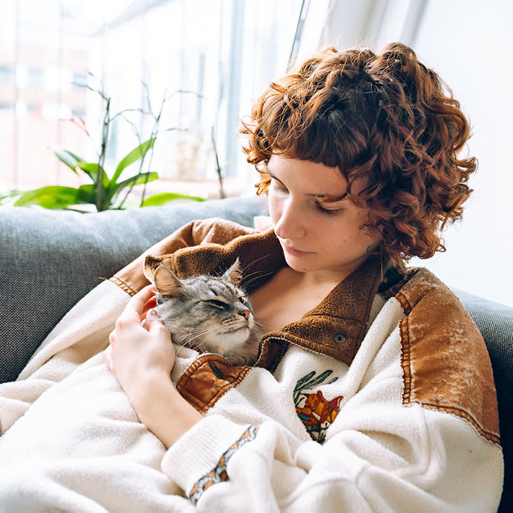Your Sleeping Cat Purrs for a Reason. Usually a Good One.